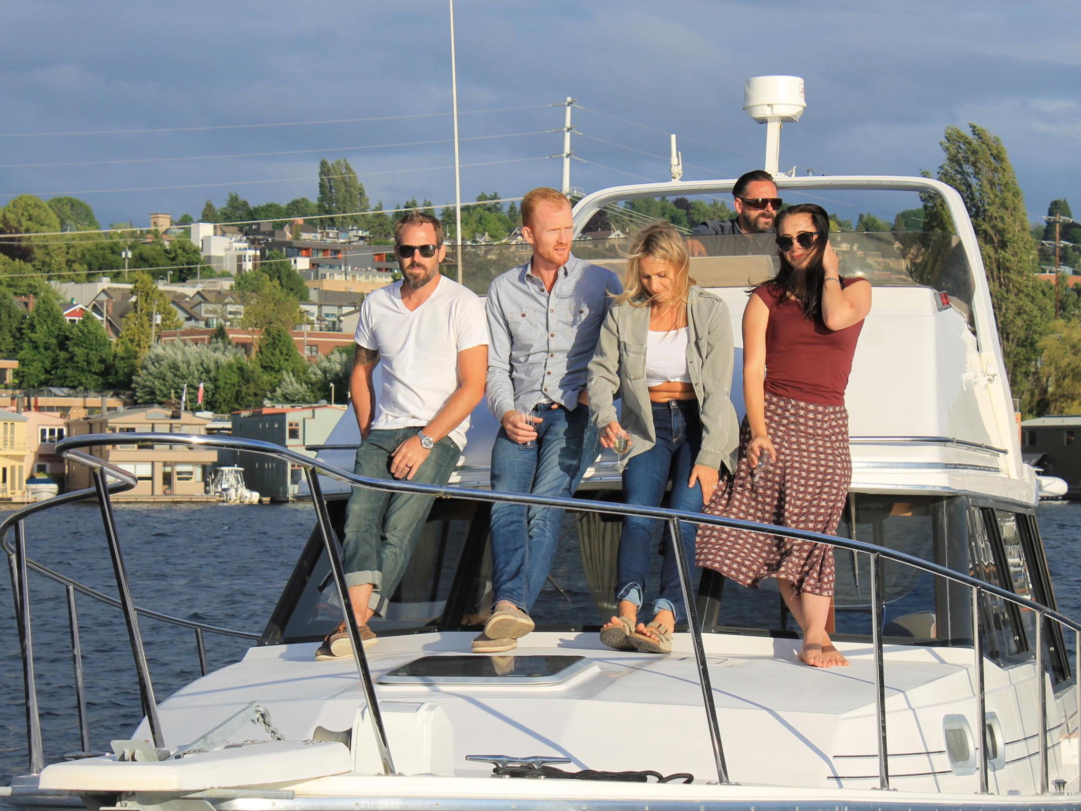 a couple of people that are standing in front of a boat